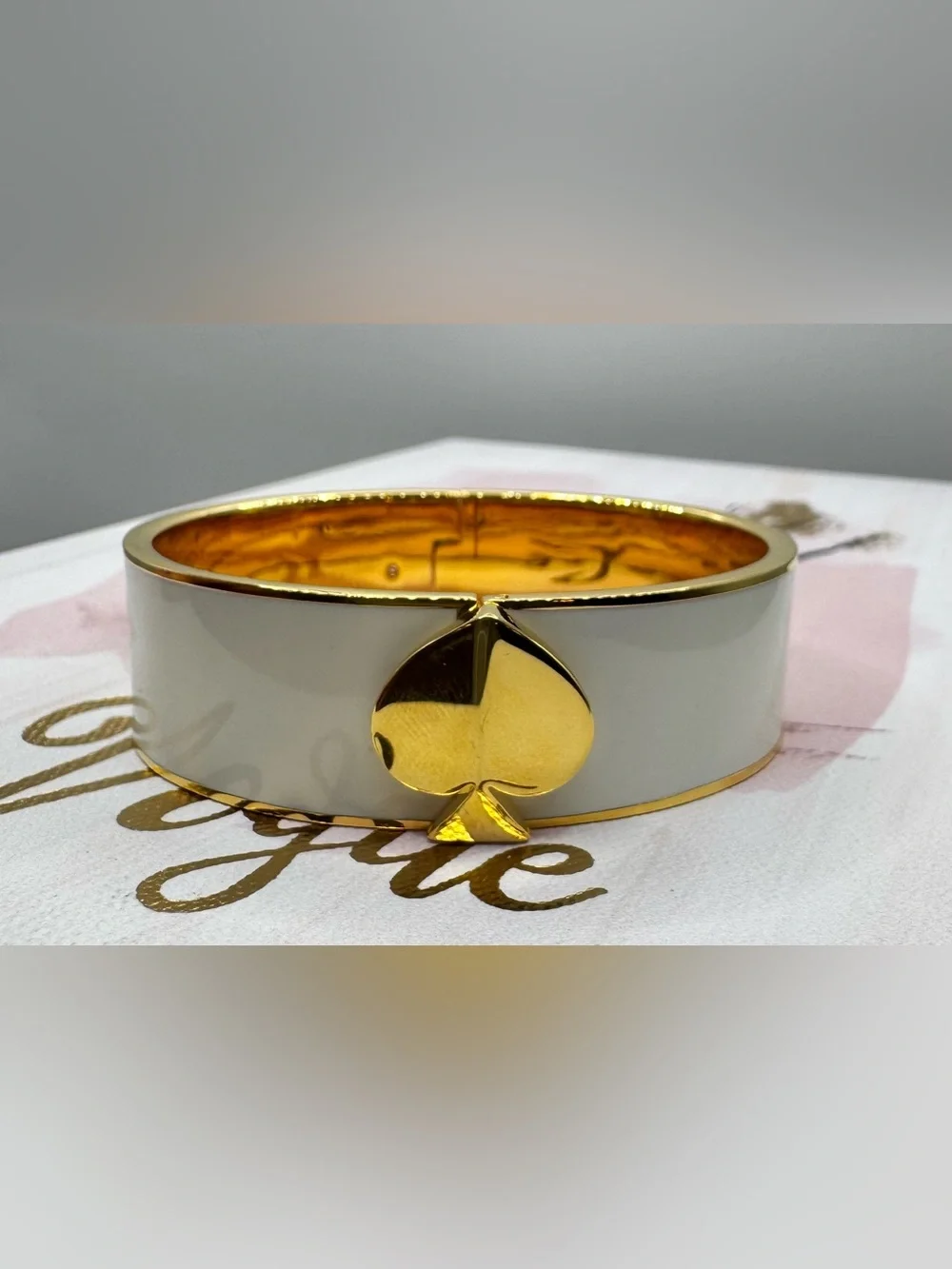 kate spade Heritage Spade Wide Enamel Bangle in Off White with Gold Accents - Picture 2 of 9